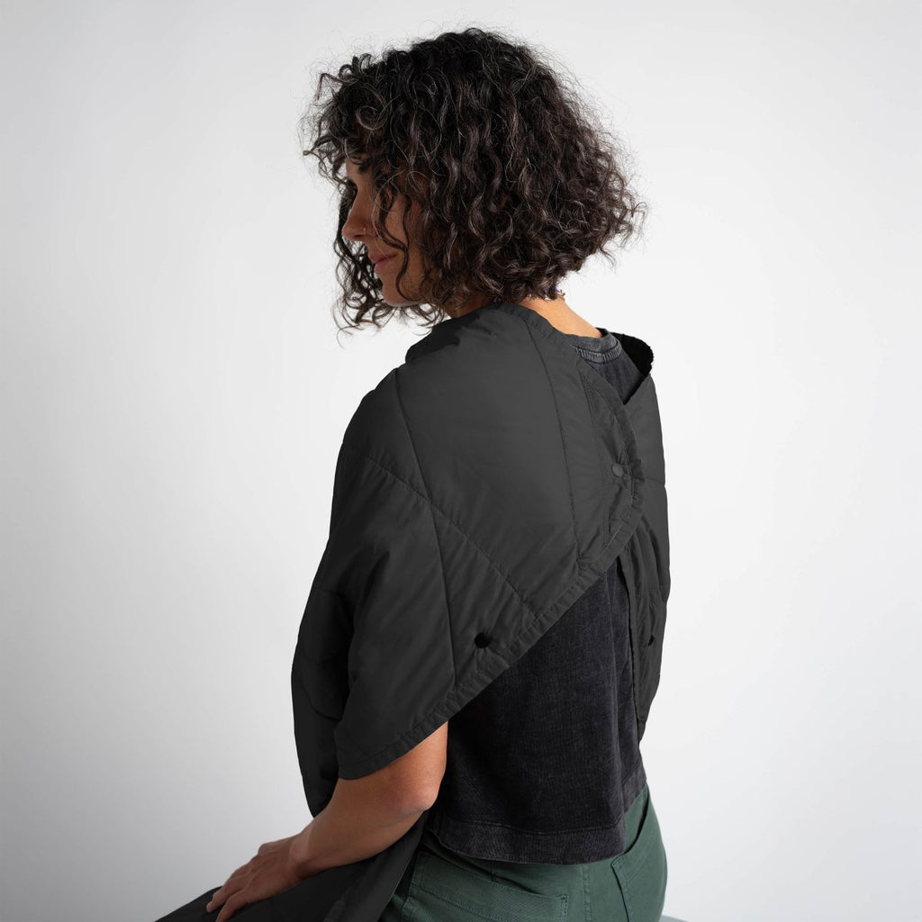 Layover™ Travel Blanket - Packable & Puffy | Black worn travel blanket for cozy comfort.