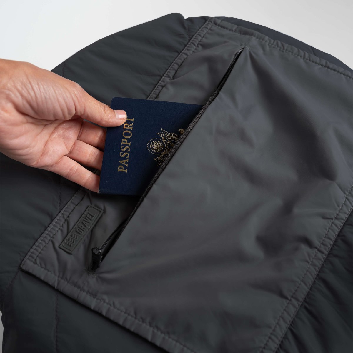 Layover™ Travel Blanket - Packable & Puffy | Black with a pocket for passport