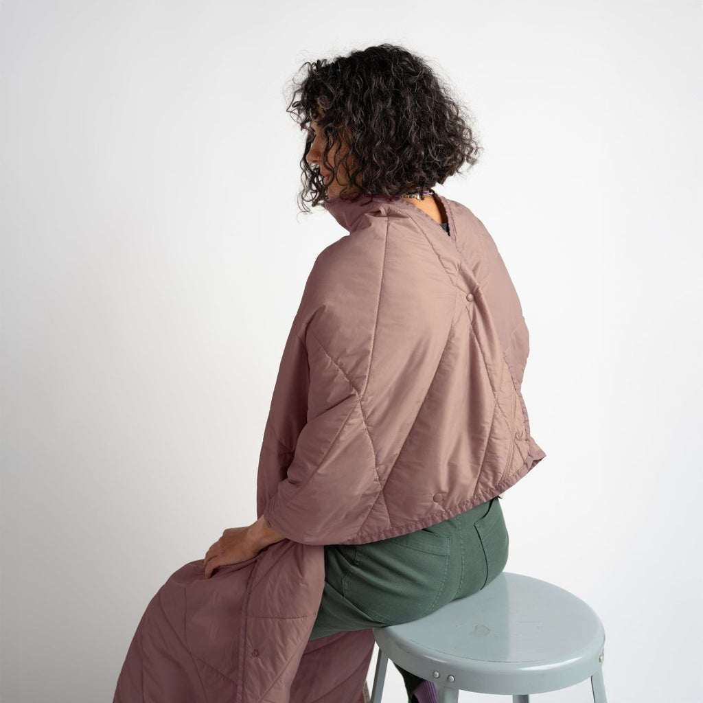 Layover™ XL Travel Blanket - Quartz in a cozy setting.