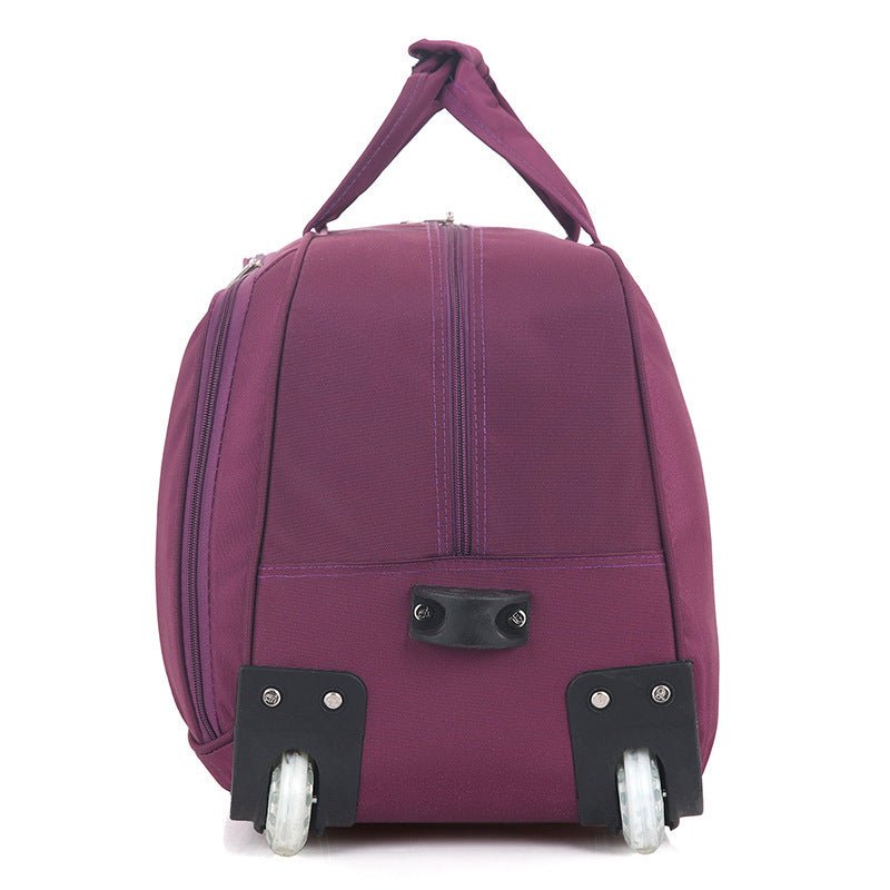 Purple rolling suitcase on a white background
