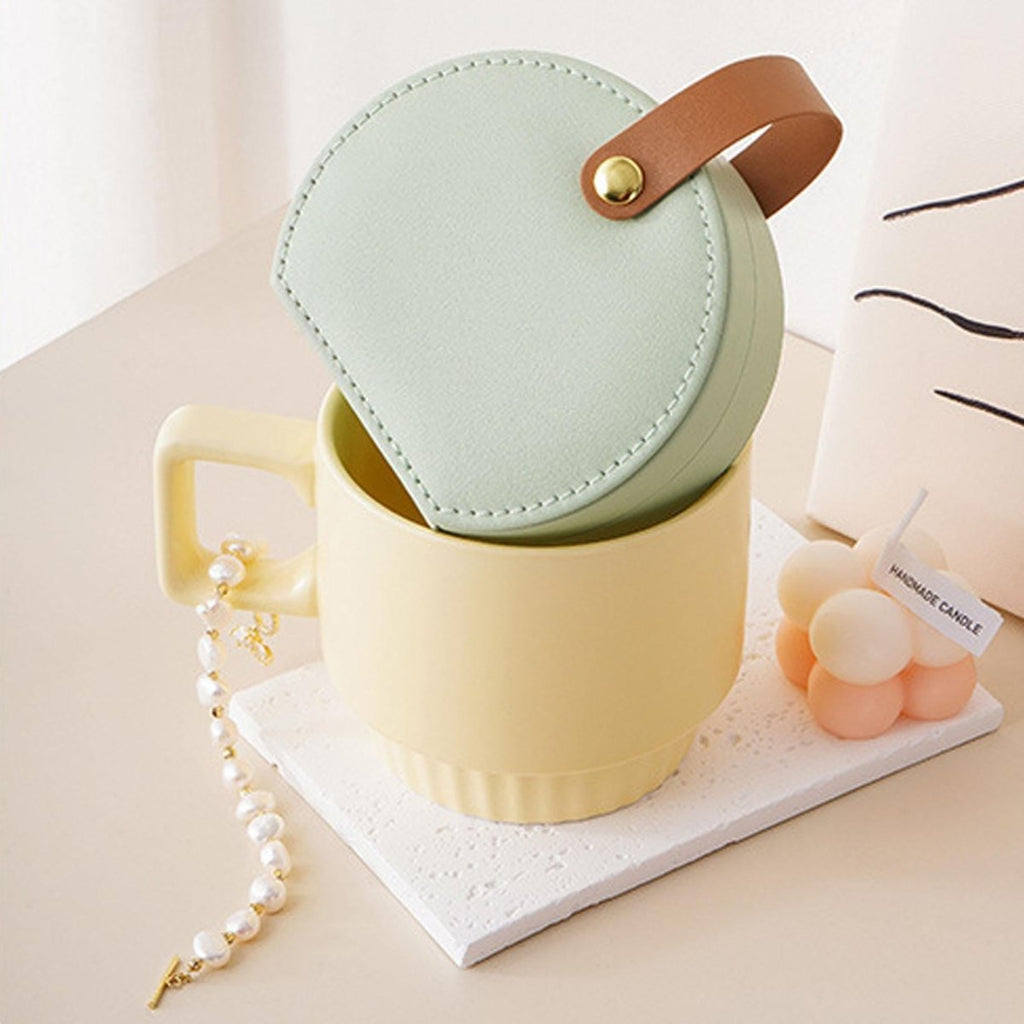 Portable Jewelry Storage Box on yellow mug with beads