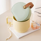 Portable Jewelry Storage Box on yellow mug with beads