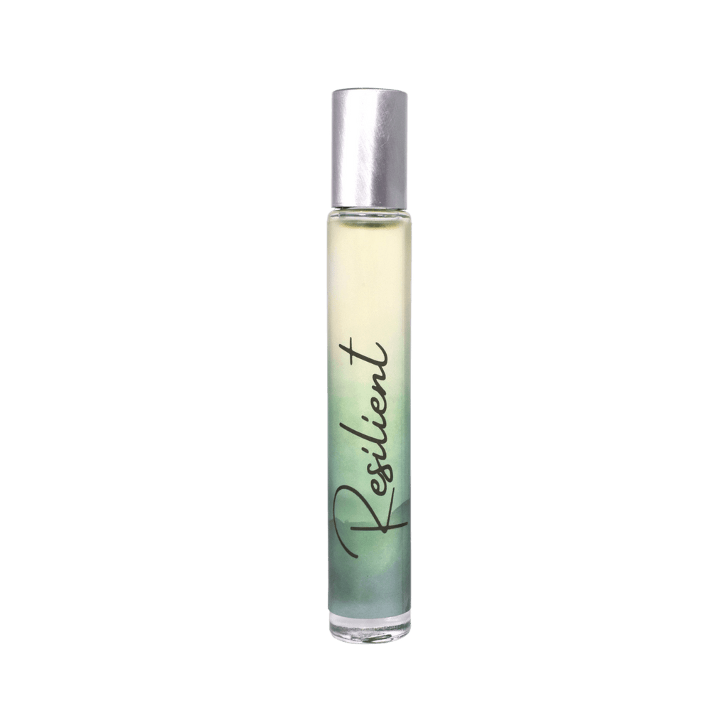 Roll-on bottle of perfume labeled 'Resilient' on a teal background