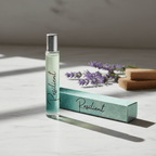 Roll-on bottle labeled 'Resilient' with its packaging on a light surface with lavender flowers in the background.