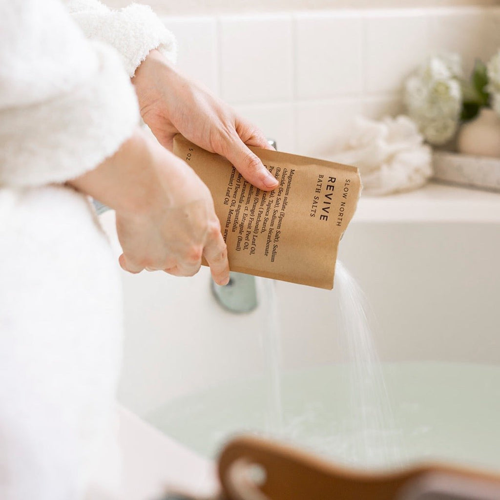 Pouring Revive Bath Salts - 5 oz Single into a bath