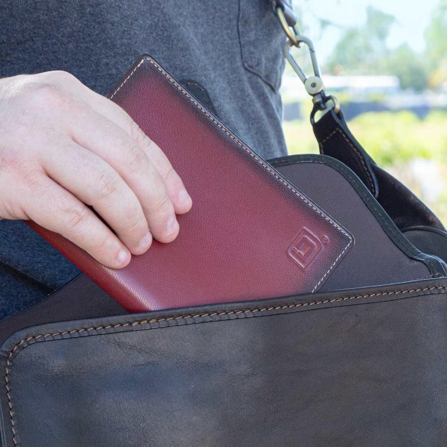 RFID Blocking Leather Passport Wallet in a travel bag