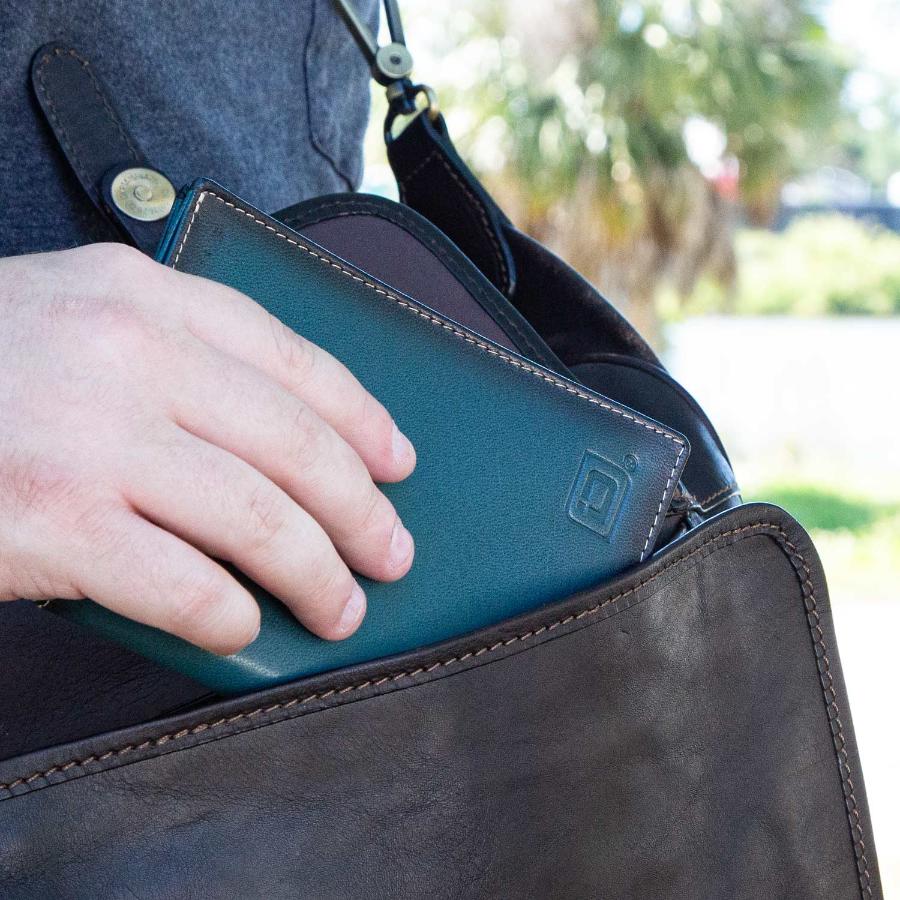 RFID Blocking Leather Passport Wallet in a travel bag pocket