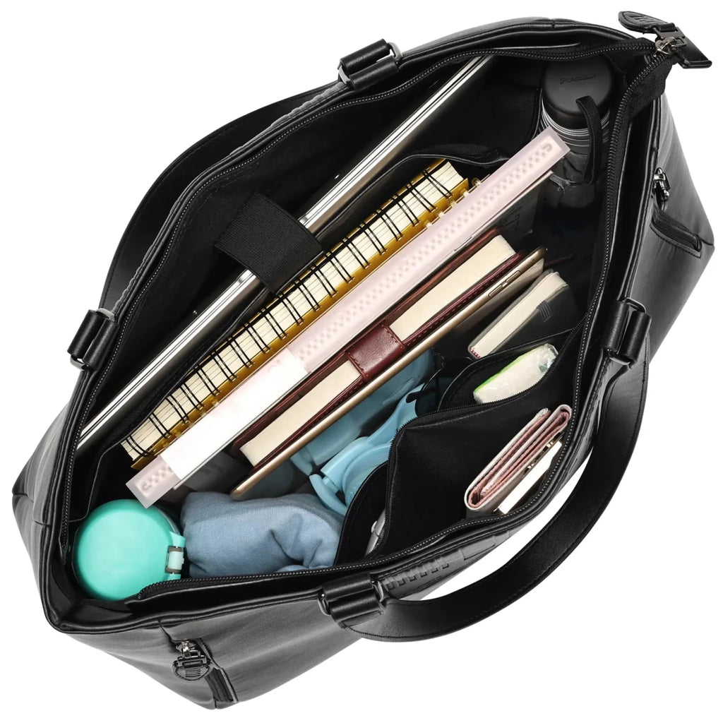 Black bag with various items including a keyboard and stationery on a white background