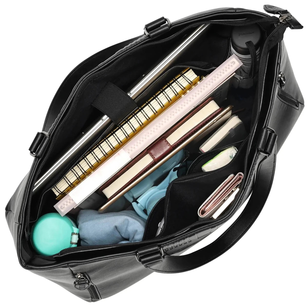 Black bag with various items including a keyboard and stationery on a white background