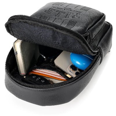 Black travel case with electronic devices inside on a white background