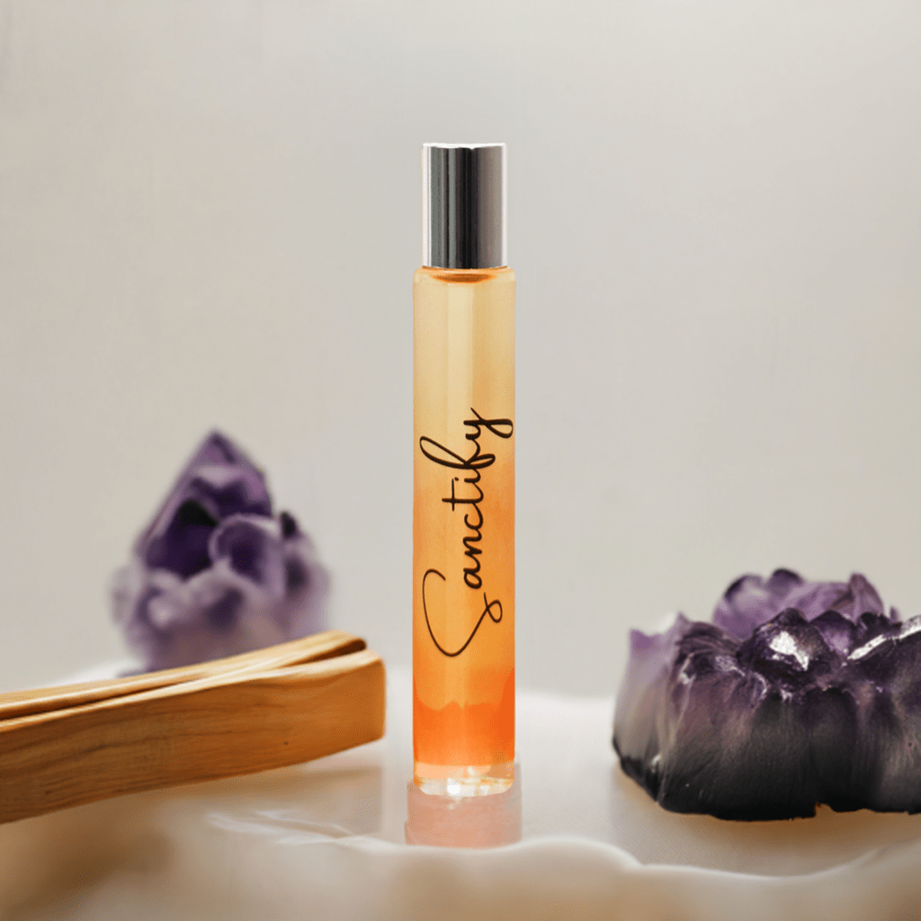 Roll-on bottle labeled 'Sanctify' with purple crystals on a light background