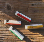 Heliotrope Shea Butter & Almond Lip Balm in travel size essentials