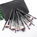 The Essentials 15-Piece Matte Black Makeup Brush Set in a sleek pouch.