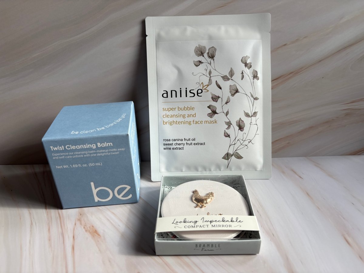 ✨ The Glow-Getter travel size essentials with compact mirror and cleansing balm.