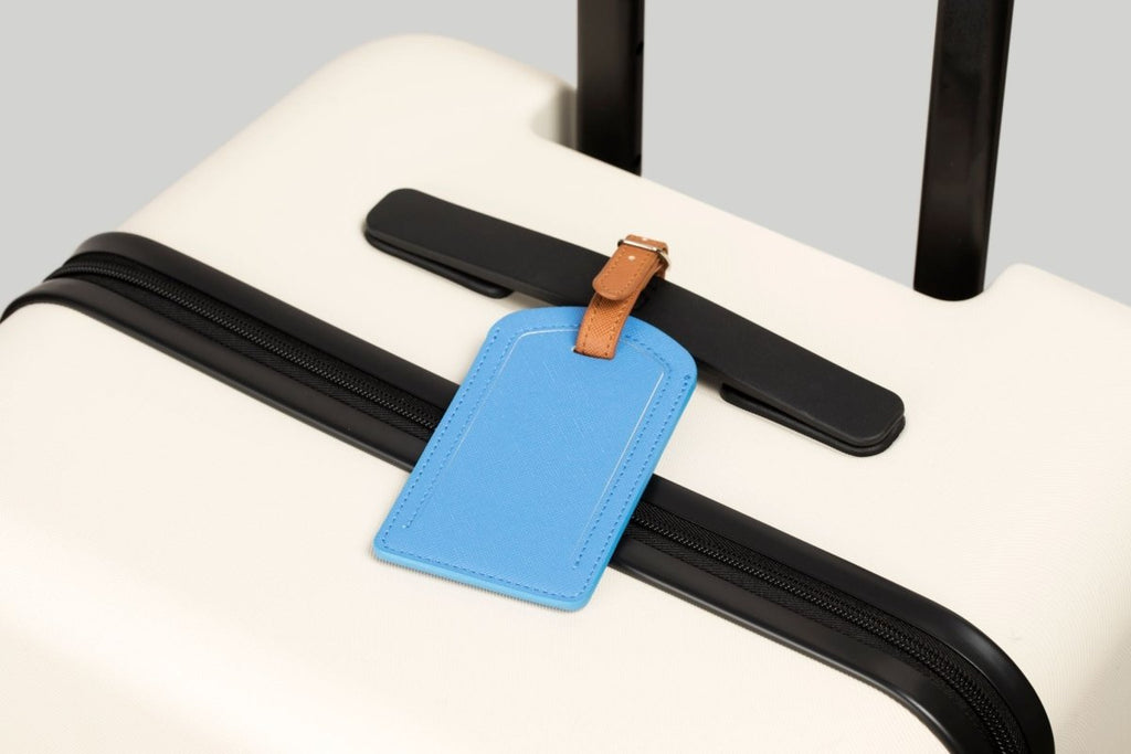 The Luggage Tag on a suitcase, perfect travel size essentials.