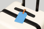 The Luggage Tag on a suitcase, perfect travel size essentials.