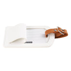 The Luggage Tag in white and brown leather, travel essential
