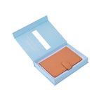 The Passport Wallet in an open gift box for travel essentials.