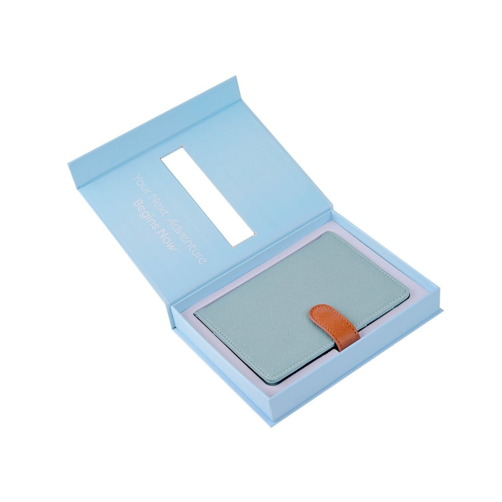 The Passport Wallet in an open box, stylish travel organizer