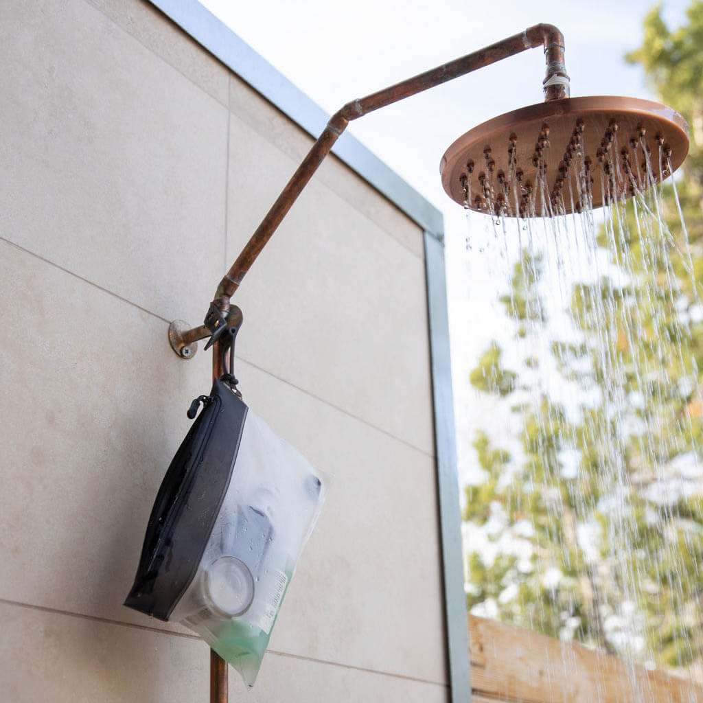 The Pouch | 3-1-1 TSA Compliant Shower Bag hanging in shower