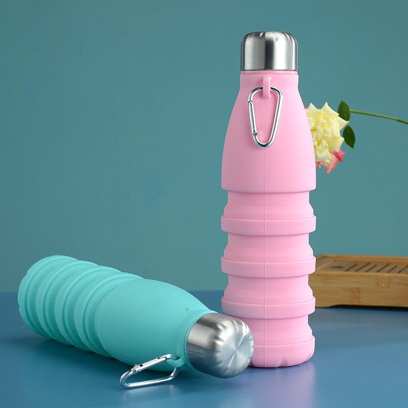 The Pro-Travel Collapsible Bottle (550ml) in pink and blue