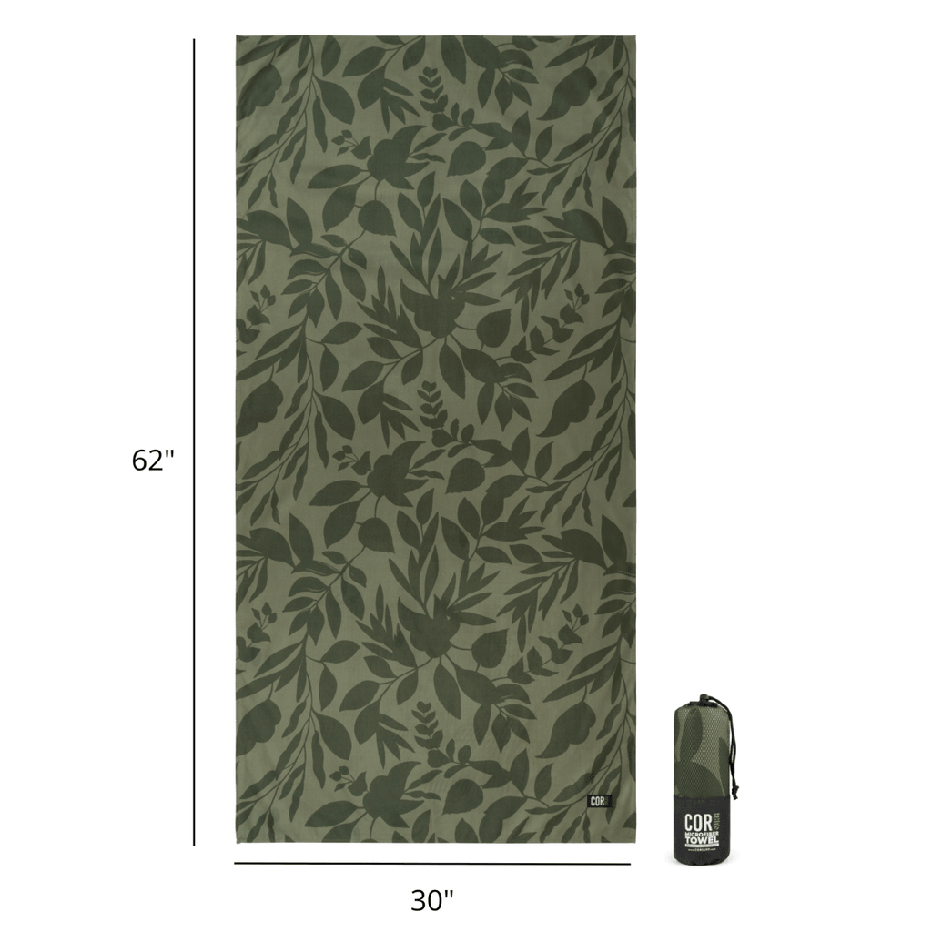 Green leaf-patterned towel with dimensions and a carrying bag on a white background