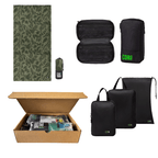 Collection of black bags with green branding, a green patterned mat, and an open cardboard box with items inside.