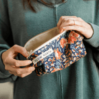 Travel Pouch - Pom Blossom with floral design, ideal for travel size essentials.