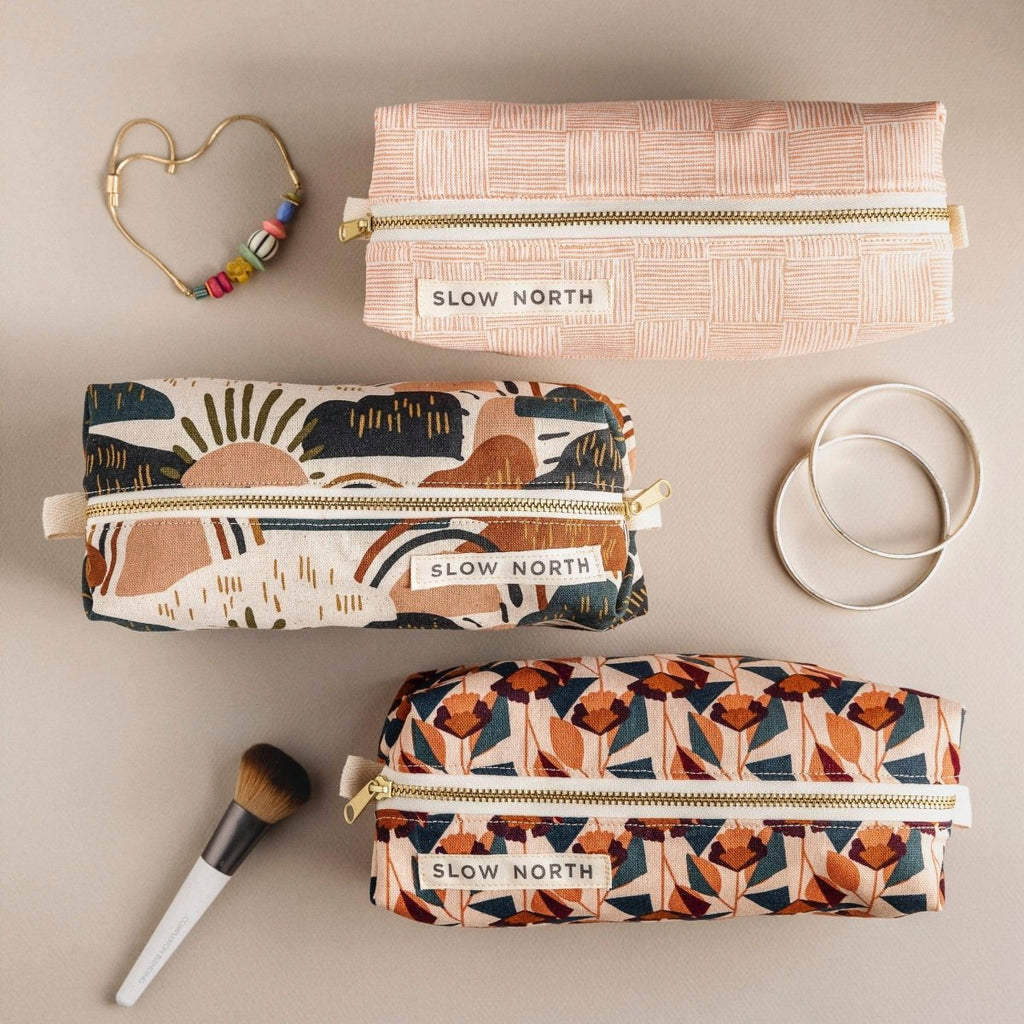 Travel Pouch - Rainbow Hil with colorful designs and gold zippers
