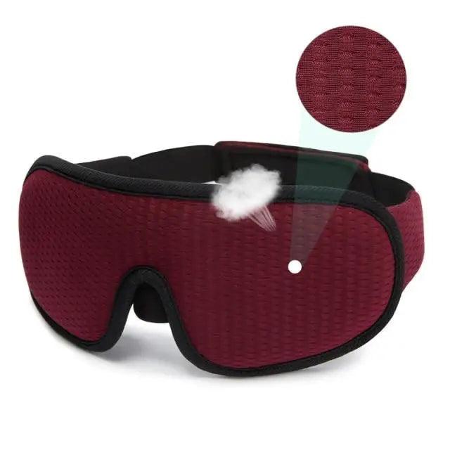 Red sleep mask with a close-up of the breathable mesh fabric on a white background.