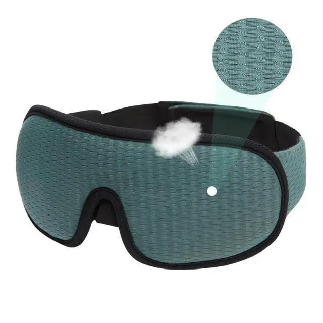 Green sleep mask with a close-up of the breathable mesh fabric on a white background.