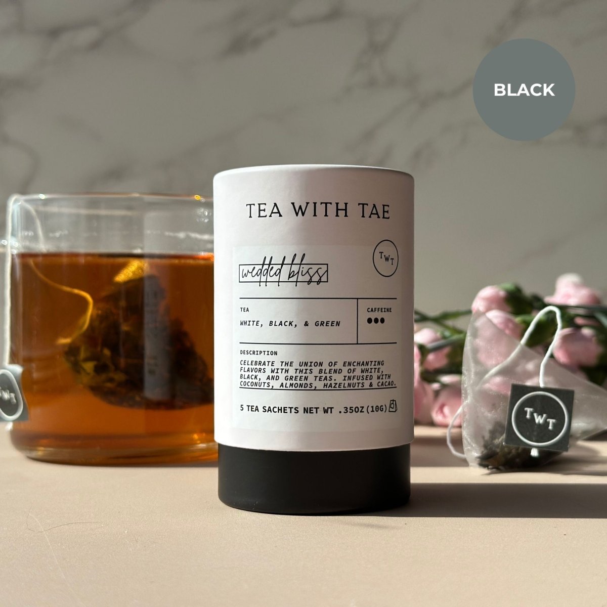 Tea package labeled 'Tea with Tae' with a cup of tea and flowers in the background.